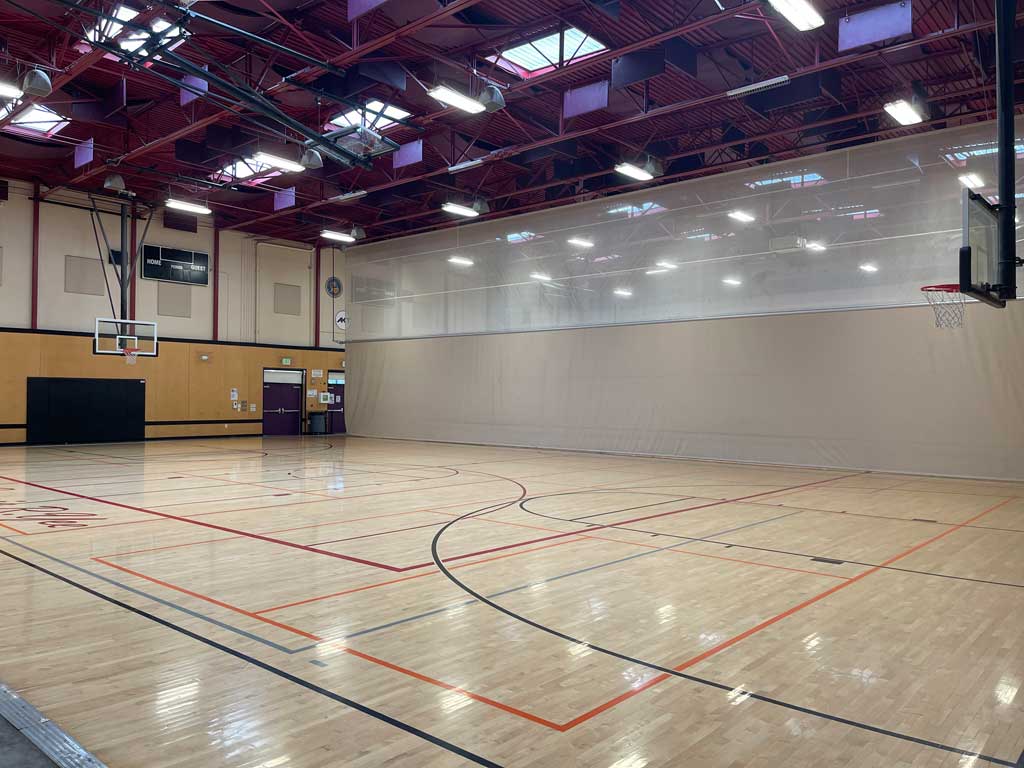 Basketball court with a partition separating the other court.